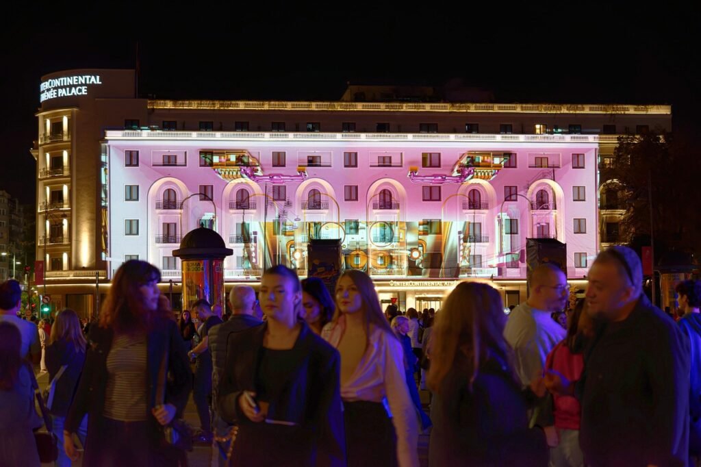 show, lights, building, event, people, crowd, night, entertainment, metropolis, projection, hotel, luxury, attraction, urban