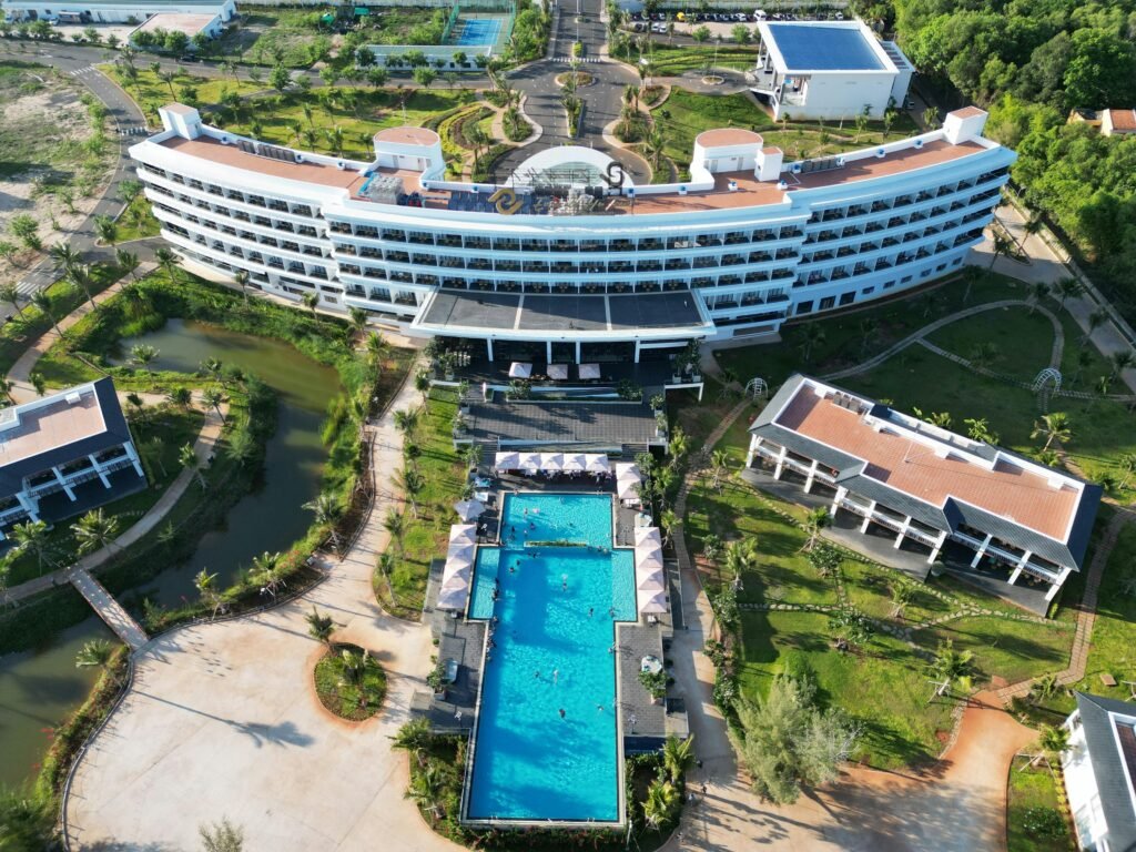 Aerial view of a luxury resort with a swimming pool in Hồ Tràm, Vietnam.